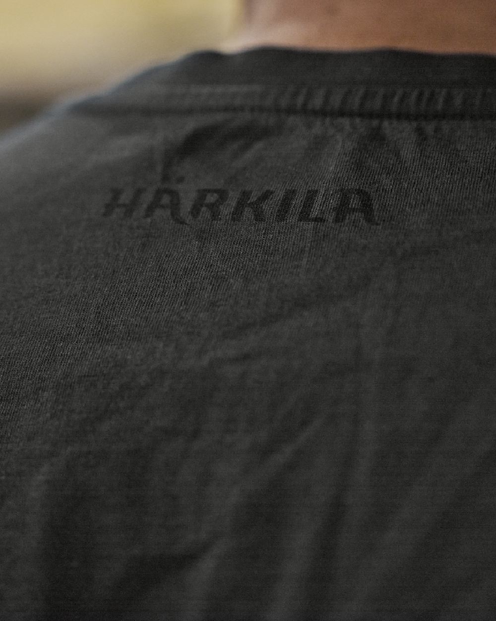 Phantom Coloured Harkila Mens H-logo Short Sleeve T-Shirt on blurry background 