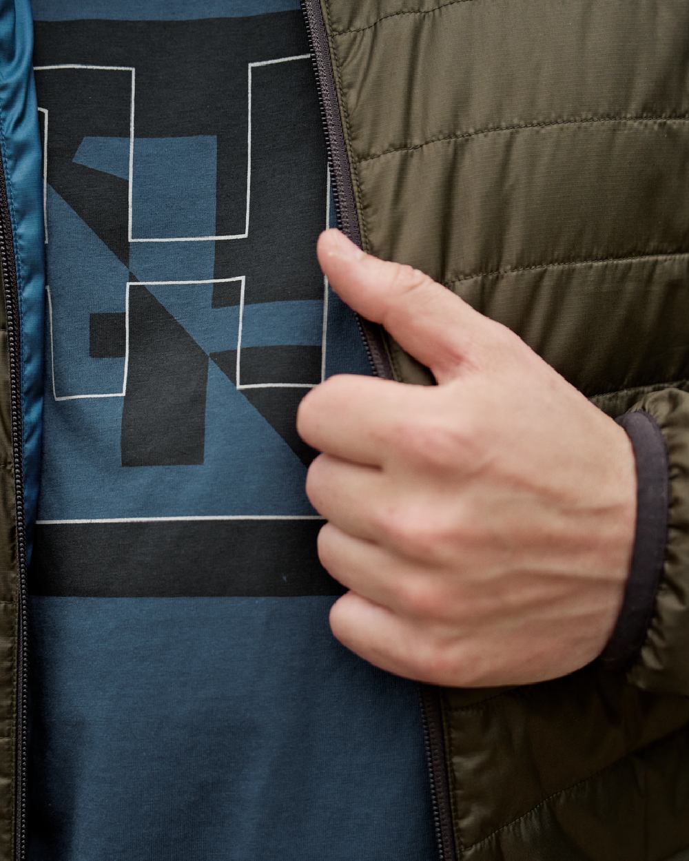 Willow Green Sea Blue Coloured Harkila Mens Kalix HSP Jacket on blurry background 