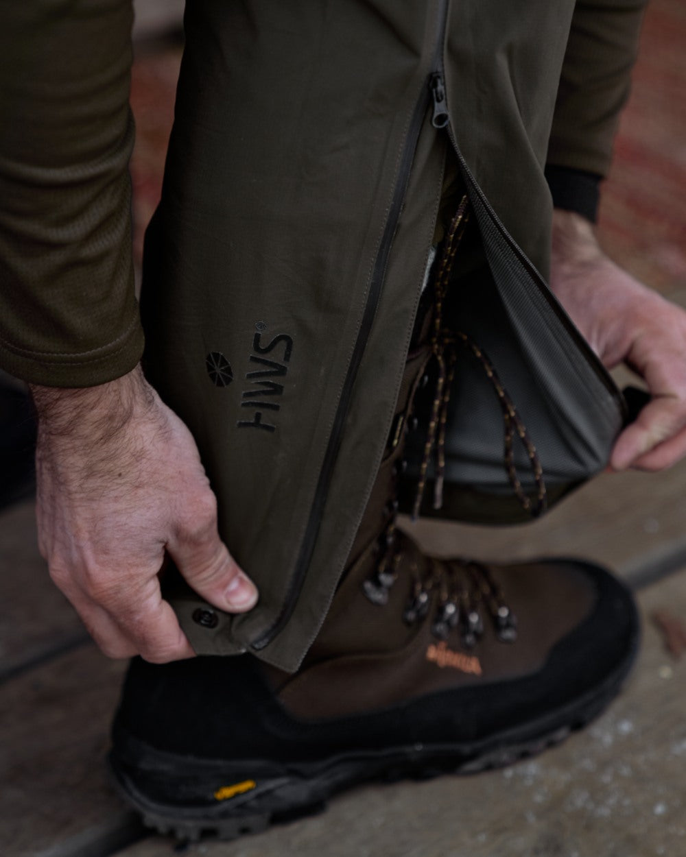 Willow Green coloured Harkila Mens Logmar HWS Packable Trousers on floor background 