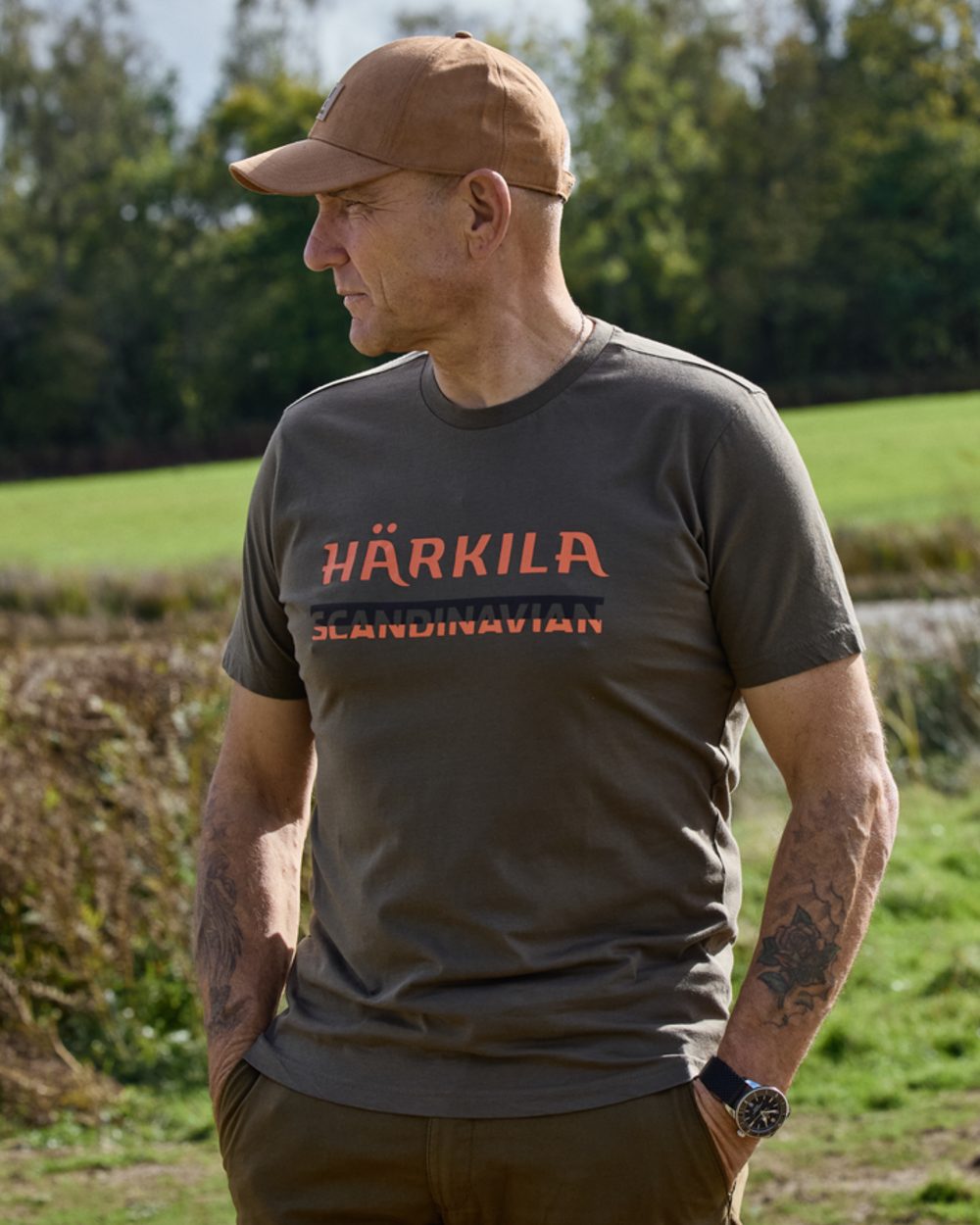 Grape Leaf coloured Harkila Mens Scandinavian Short Sleeve T-Shirt on forest background 