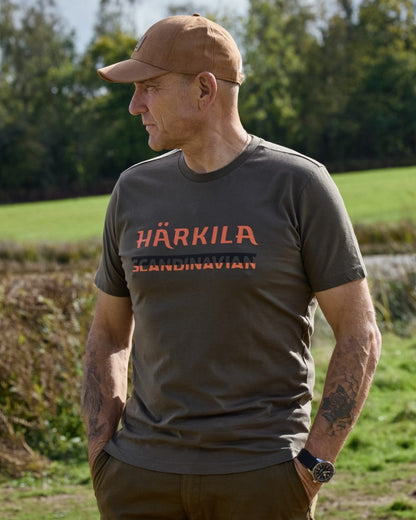 Grape Leaf coloured Harkila Mens Scandinavian Short Sleeve T-Shirt on forest background 