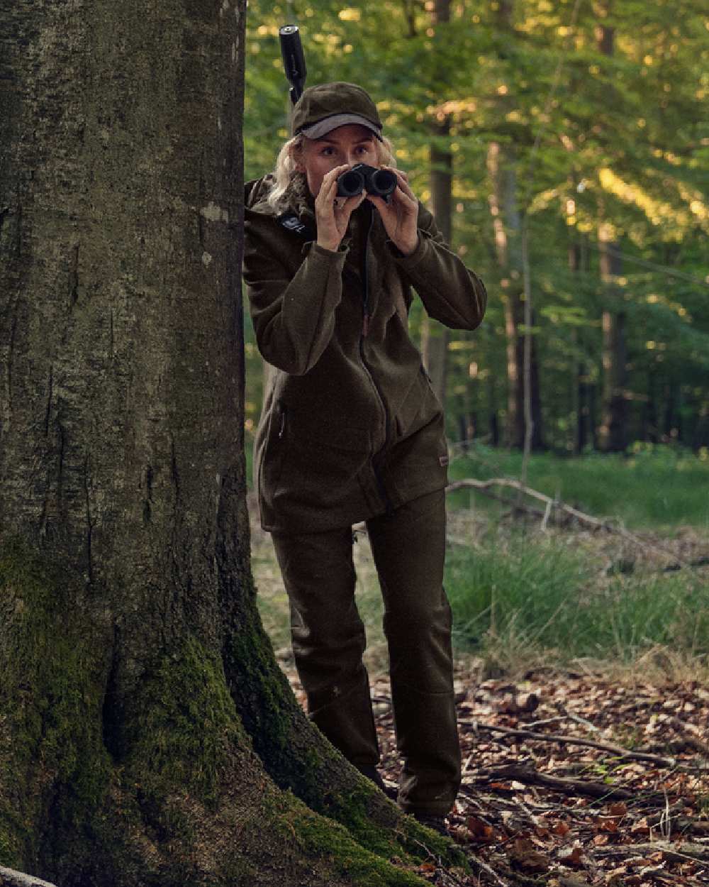 Willow Green Coloured Harkila Metso Womens Hybrid Jacket on outdoor background 