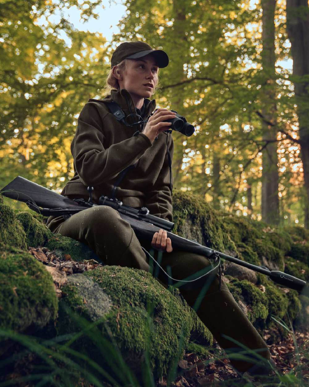Willow Green Coloured Harkila Metso Womens Hybrid Jacket on outdoor background 