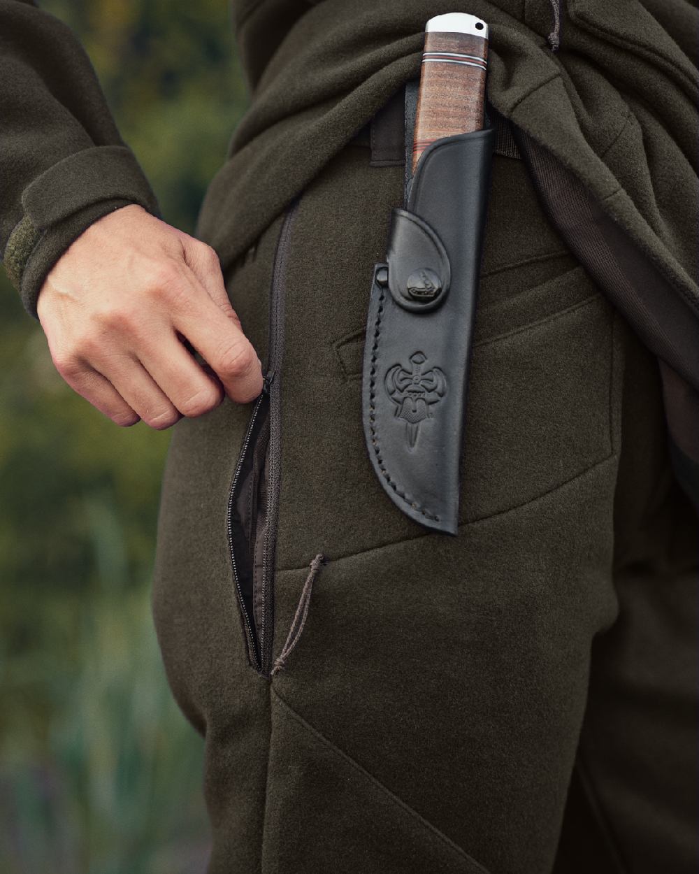 Willow Green Coloured Harkila Metso Womens Hybrid Trousers on outdoor background 