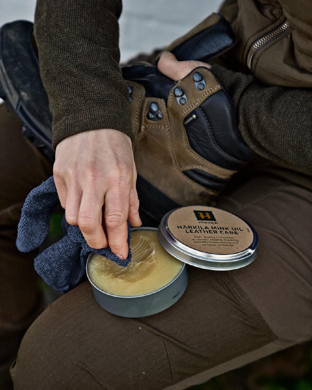 Neutral Coloured Harkila Mink Oil Leather Care 170 ml on outdoor background 