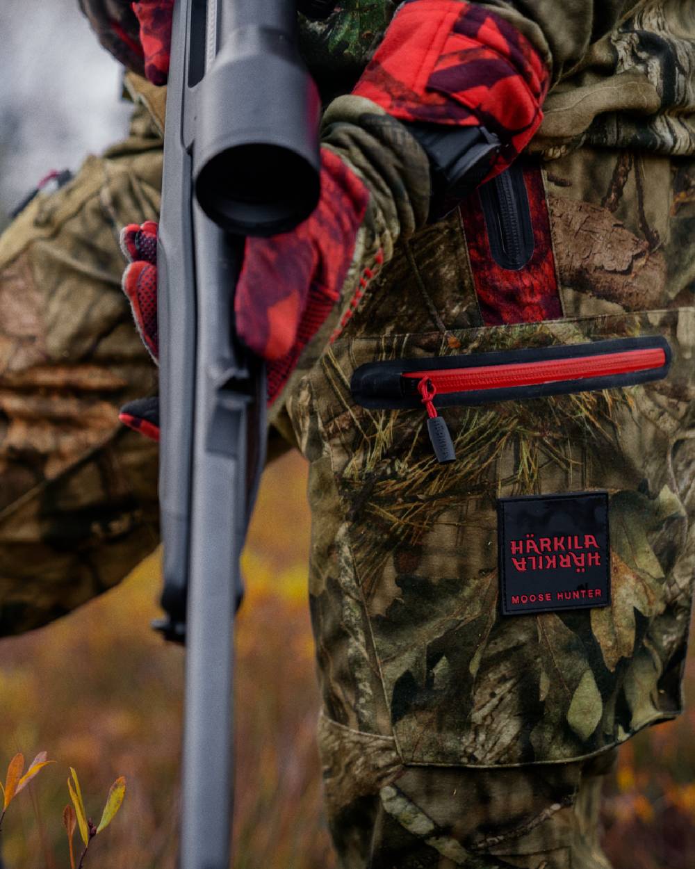 MossyOak Break-Up Country MossyOak Red Coloured Harkila Moose Hunter 2.0 GTX Trousers on outdoor background 