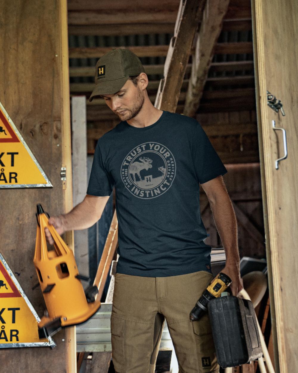 Dark Navy Coloured Harkila Moose Short Sleeve T-Shirt on garage background 