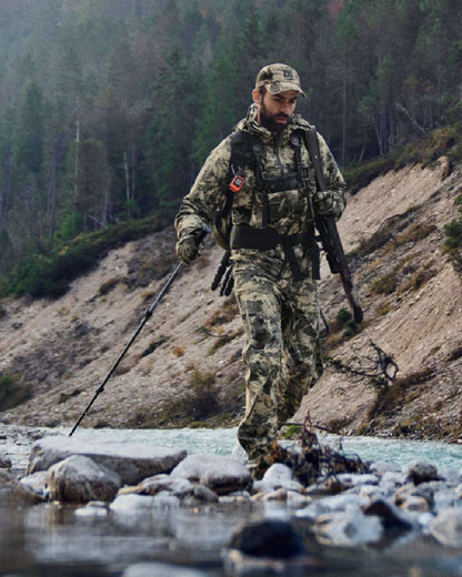 AXIS Mountain Coloured Harkila Mountain Hunter Expedition HWS Packable Jacket on outdoor background 