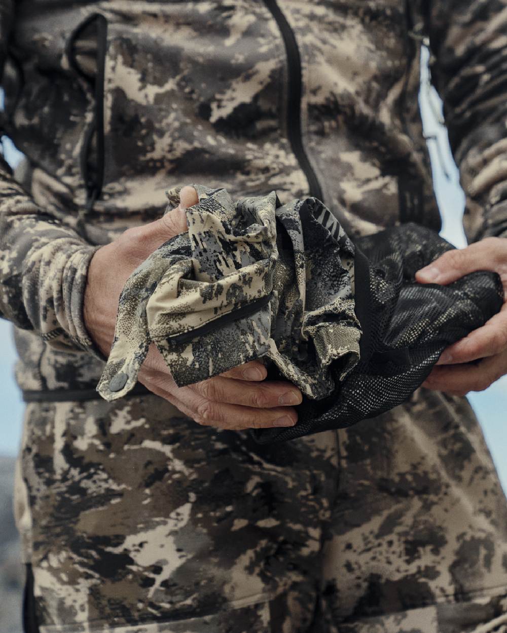 AXIS Mountain Coloured Harkila Mountain Hunter Expedition HWS Packable Jacket on outdoor background 