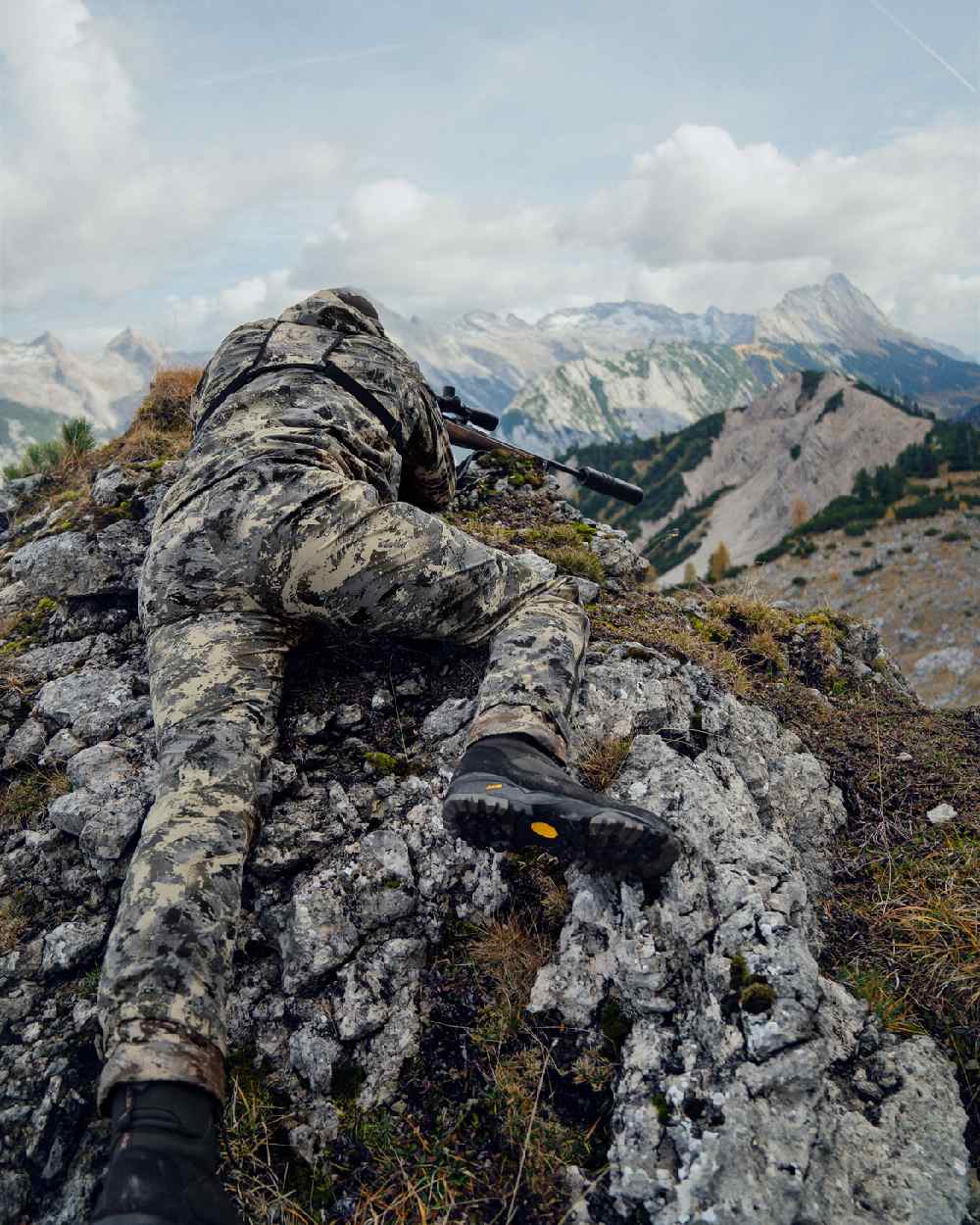 AXIS Mountain Coloured Harkila Mountain Hunter Expedition HWS Packable Trousers on mountain background 