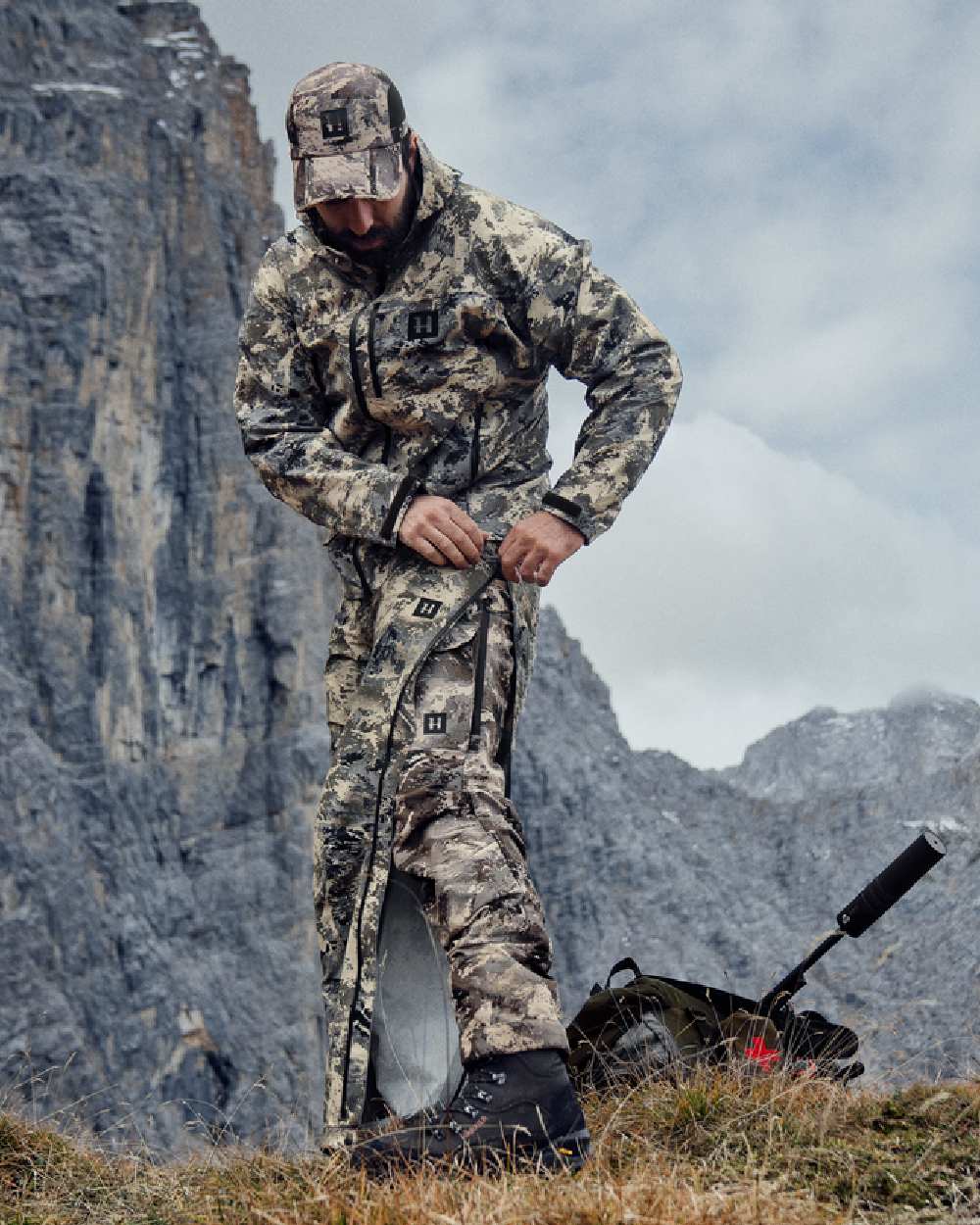 AXIS Mountain Coloured Harkila Mountain Hunter Expedition HWS Packable Trousers on mountain background 