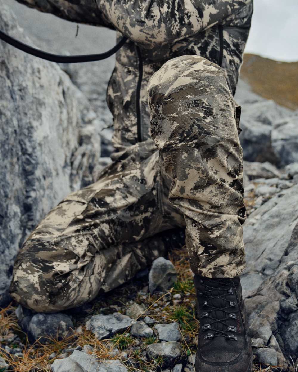 AXIS Mountain Coloured Harkila Mountain Hunter Expedition Light Trousers on outdoor background 