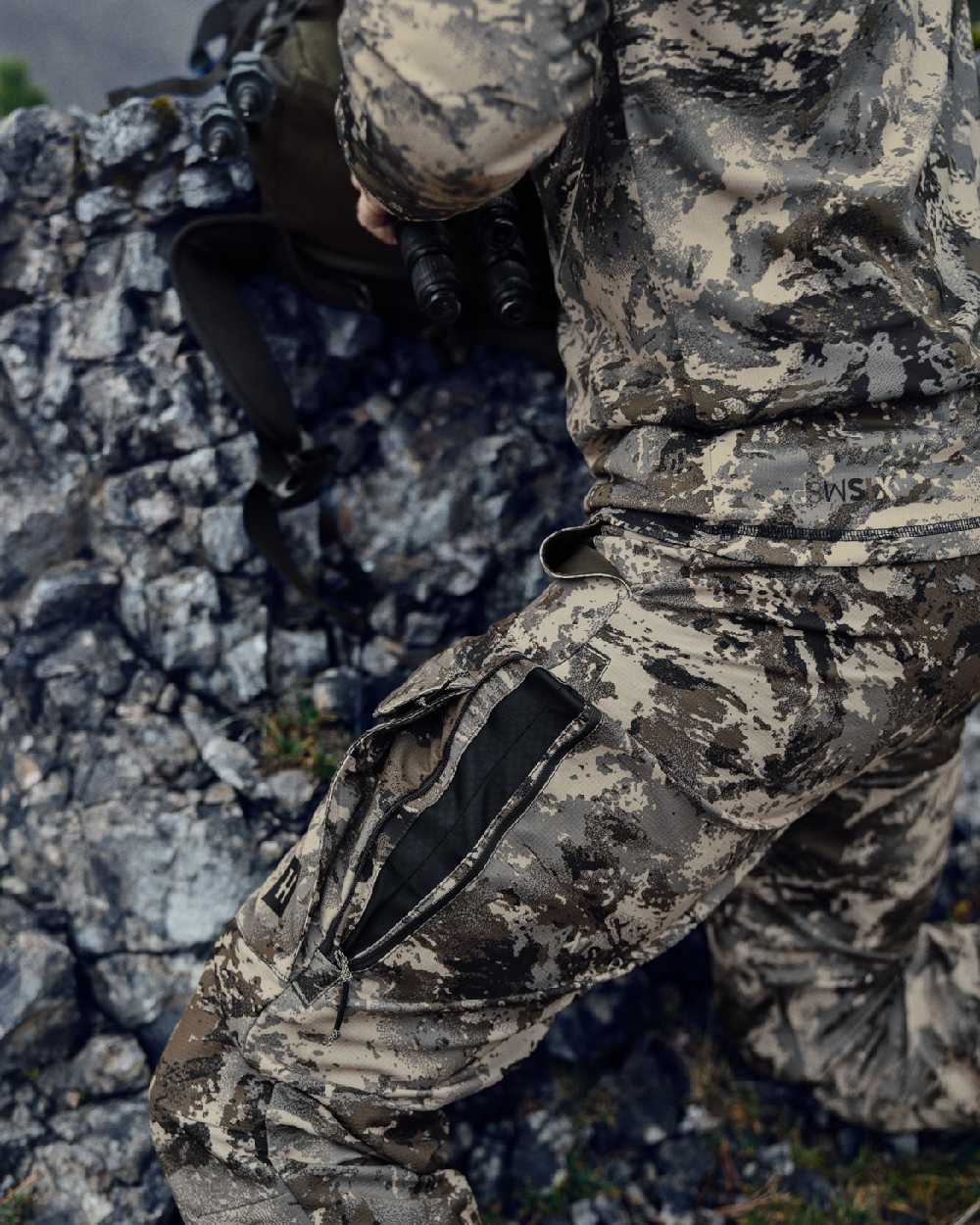AXIS Mountain Coloured Harkila Mountain Hunter Expedition Light Trousers on outdoor background 