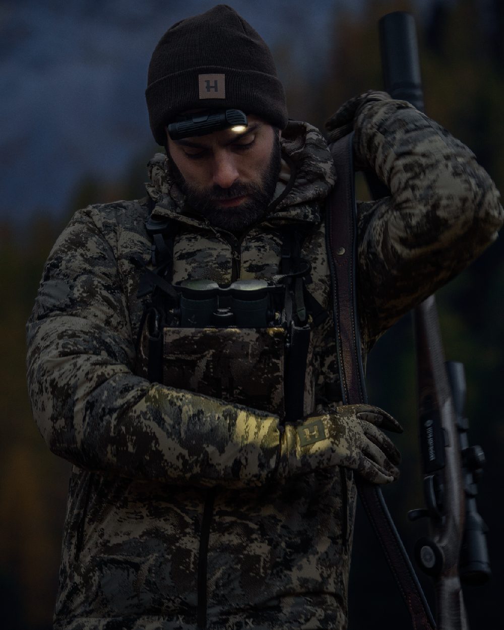 AXIS Mountain Coloured Harkila Mountain Hunter Expedition Packable Down Jacket on outdoor background 