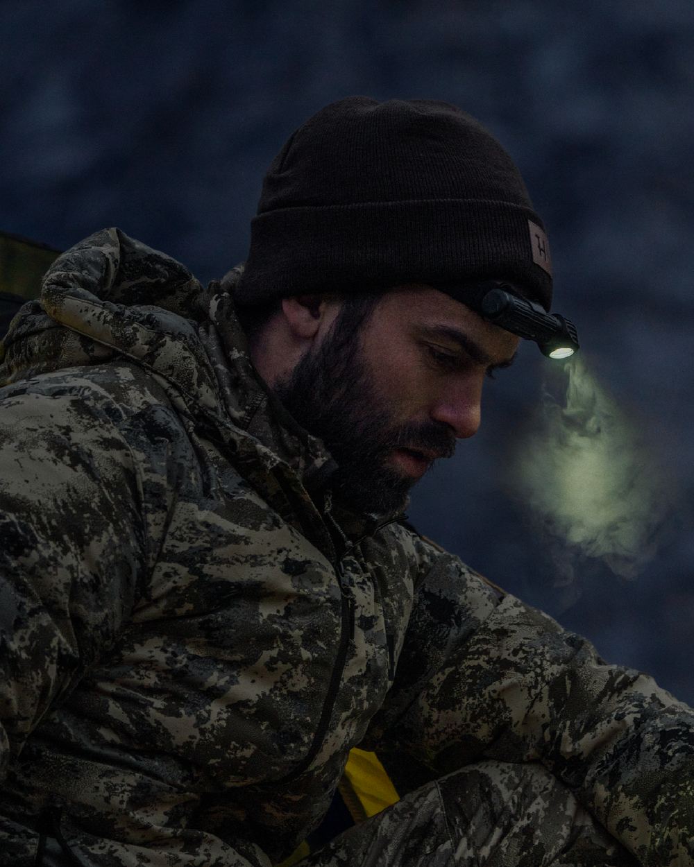 AXIS Mountain Coloured Harkila Mountain Hunter Expedition Packable Down Jacket on outdoor background 