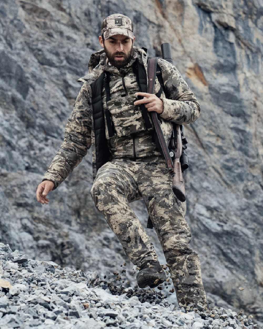 AXIS Mountain Coloured Harkila Mountain Hunter Expedition Packable Down Jacket on outdoor background 