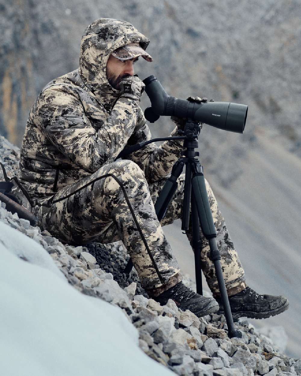 AXIS Mountain Coloured Harkila Mountain Hunter Expedition Packable Down Jacket on outdoor background 