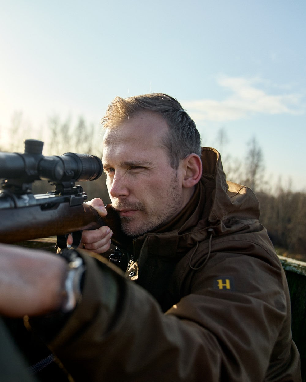 Willow Green Coloured Harkila Nordic Hunter HWS Jacket on outdoor background 