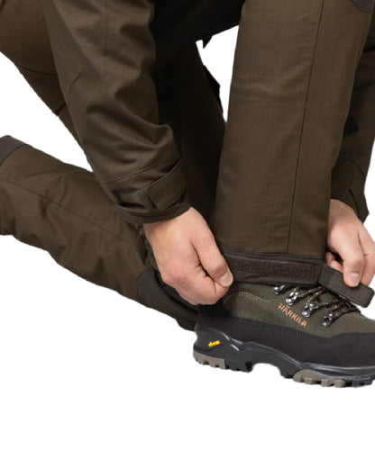 Willow Green Shadow Brown Coloured Harkila Nordic Hunter HWS Trousers on white background 