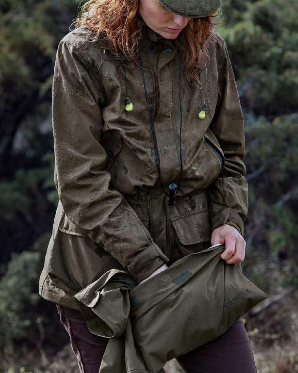 Willow Green Coloured Harkila Orton Packable Lady Jacket on outdoor background 
