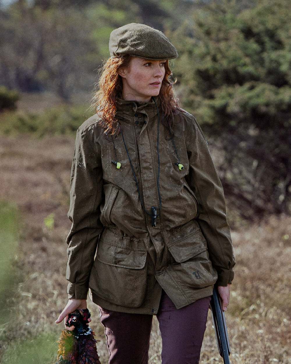 Willow Green Coloured Harkila Orton Packable Lady Jacket on outdoor background 