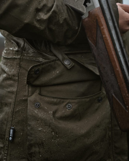 Willow Green Coloured Harkila Orton Packable Lady Jacket on outdoor background 