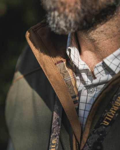 Naval Blue Coloured Harkila Portfield Long Sleeve Shirt on blurry background 