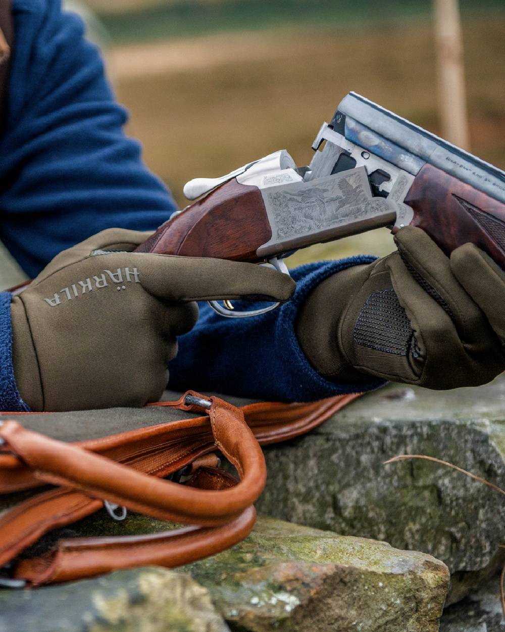 Shadow Brown Coloured Harkila Power Stretch Gloves on outdoor background 