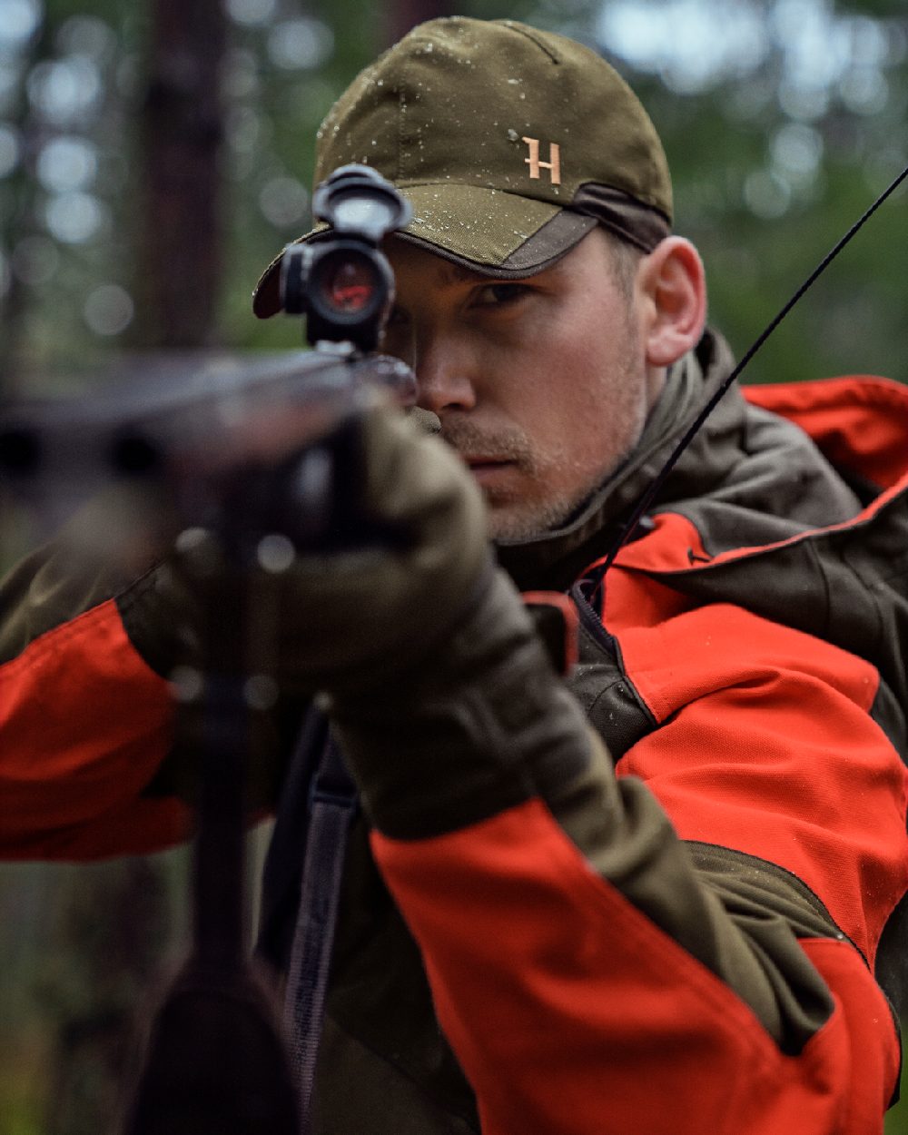 Willow Green Orange Coloured Harkila Pro Hunter Dog Keeper GTX Jacket on outdoor background 
