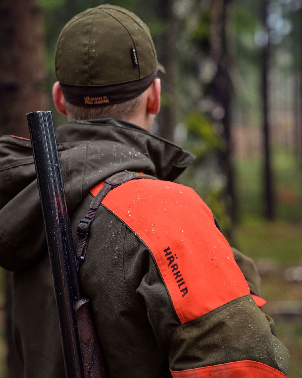 Willow Green Orange Coloured Harkila Pro Hunter Dog Keeper GTX Jacket on outdoor background 