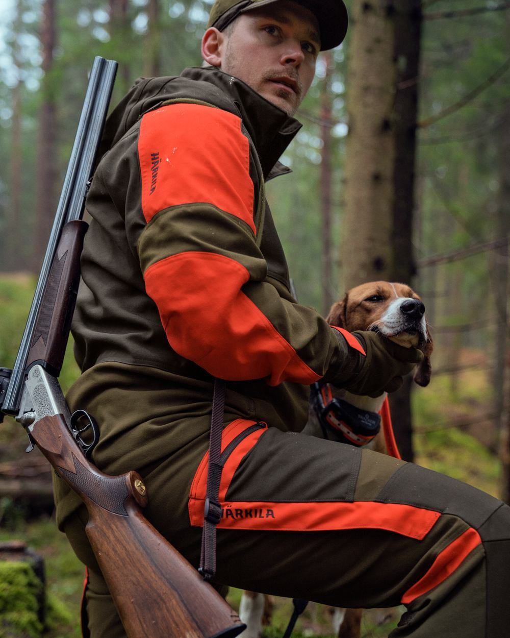Willow Green Orange Coloured Harkila Pro Hunter Dog Keeper GTX Trousers on forest background 