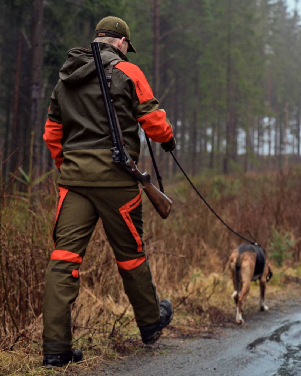 Willow Green Orange Coloured Harkila Pro Hunter Dog Keeper GTX Trousers on forest background 