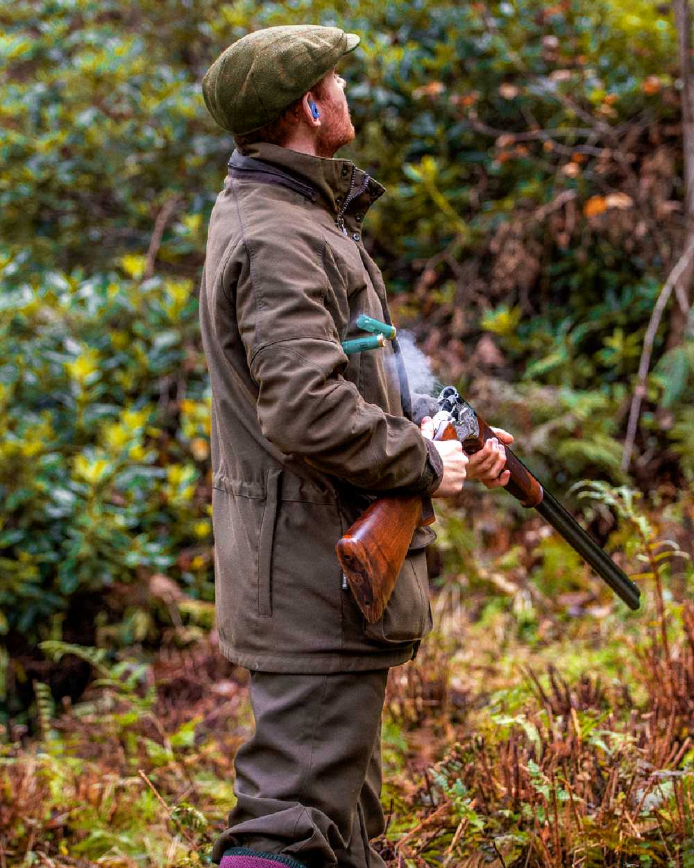 Willow Green Coloured Harkila Pro Hunter Endure Jacket on forest background 