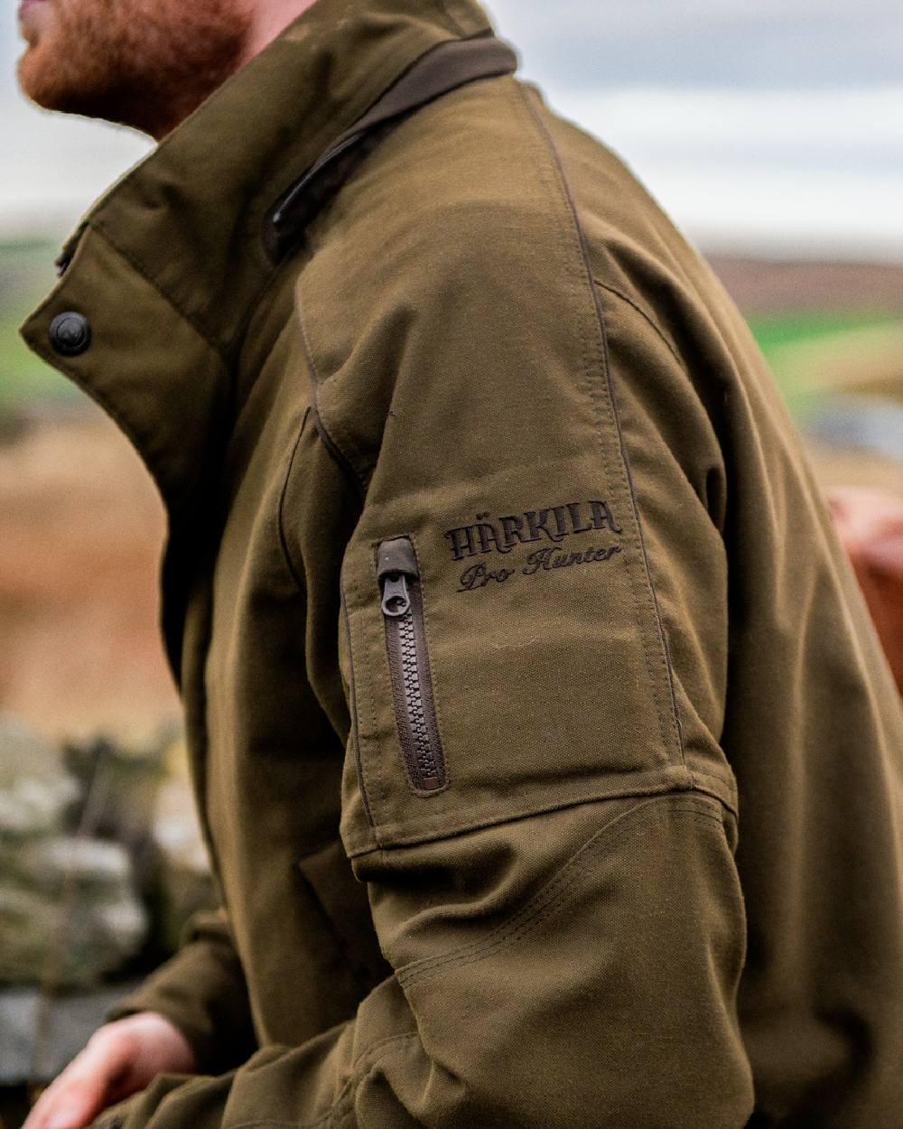 Willow Green Coloured Harkila Pro Hunter Endure Jacket on outdoor background 