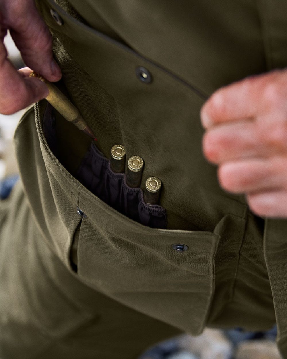 Willow Green Coloured Harkila Pro Hunter Endure Jacket on outdoor background 