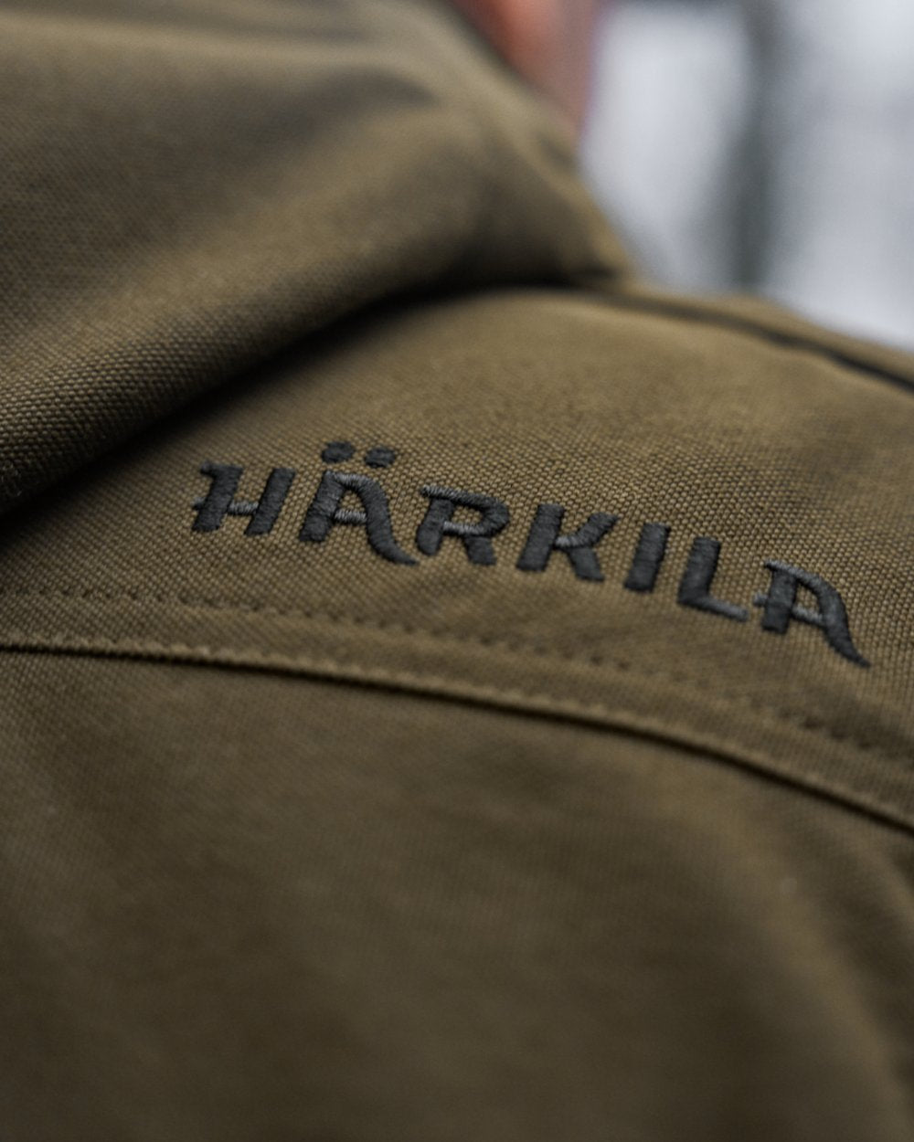 Willow Green Coloured Harkila Pro Hunter GTX Legacy Jacket on outdoor background 