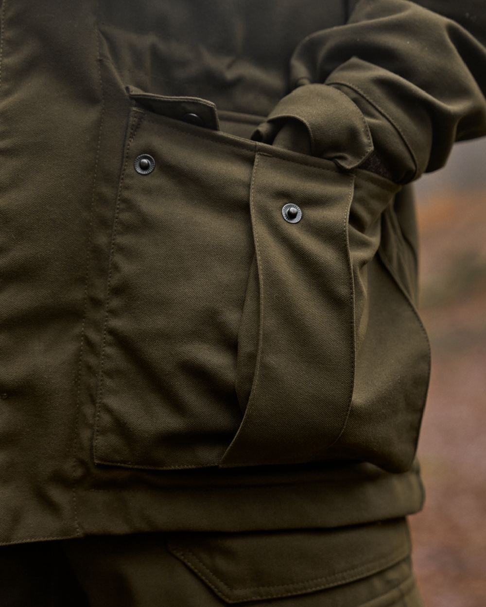 Willow Green Coloured Harkila Pro Hunter GTX Legacy Jacket on outdoor background 
