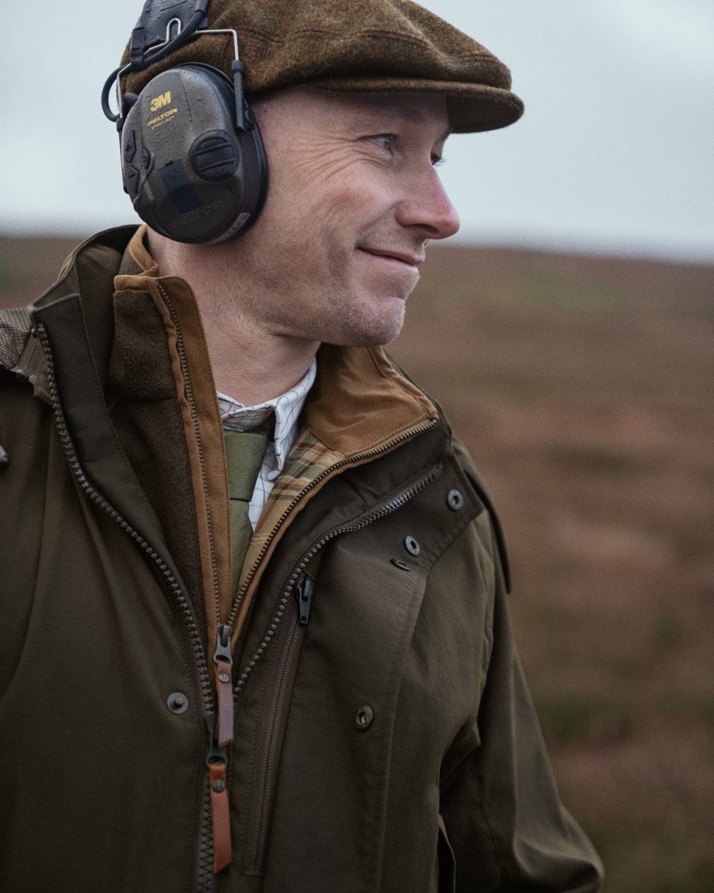 Willow Green Coloured Harkila Pro Hunter Shooting GTX Jacket on outdoor background 