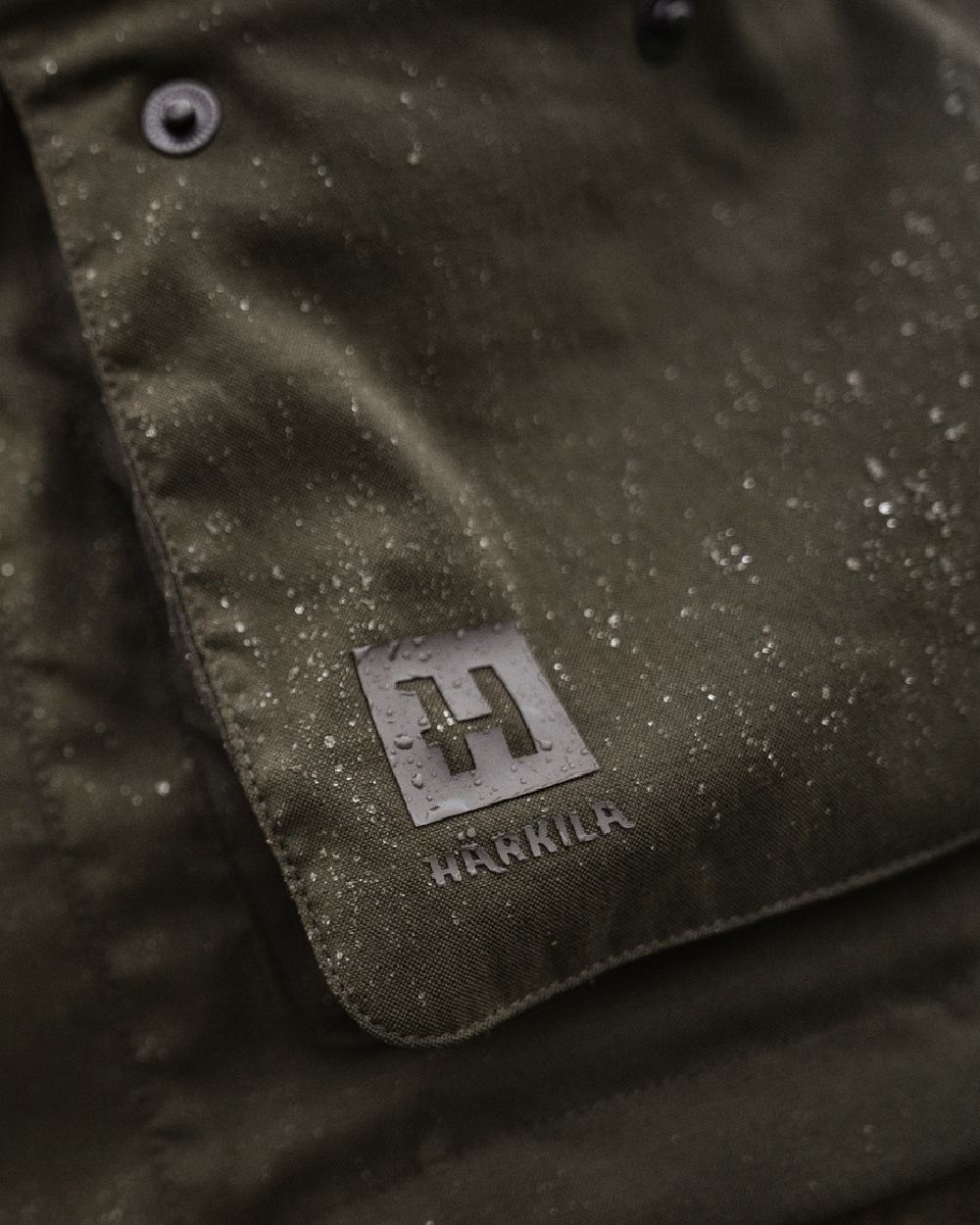 Willow Green Coloured Harkila Pro Hunter Shooting GTX Jacket on outdoor background 