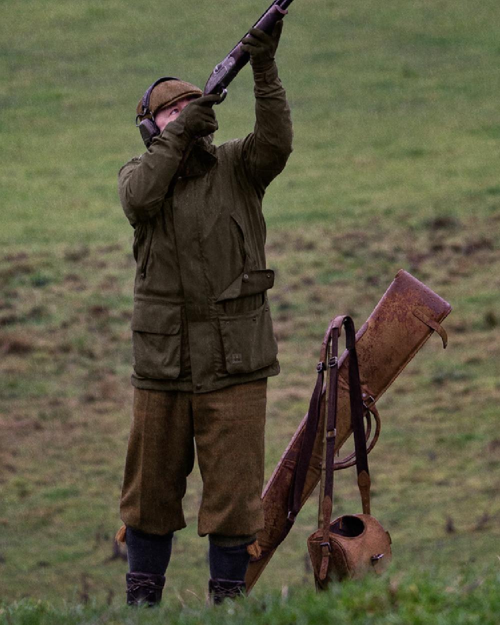 Willow Green Coloured Harkila Pro Hunter Shooting GTX Jacket on outdoor background 