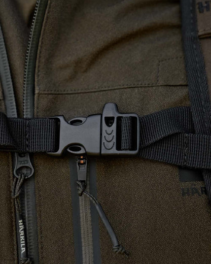 Willow Green Coloured Harkila Ragnar First Aid Backpack on blurry background 