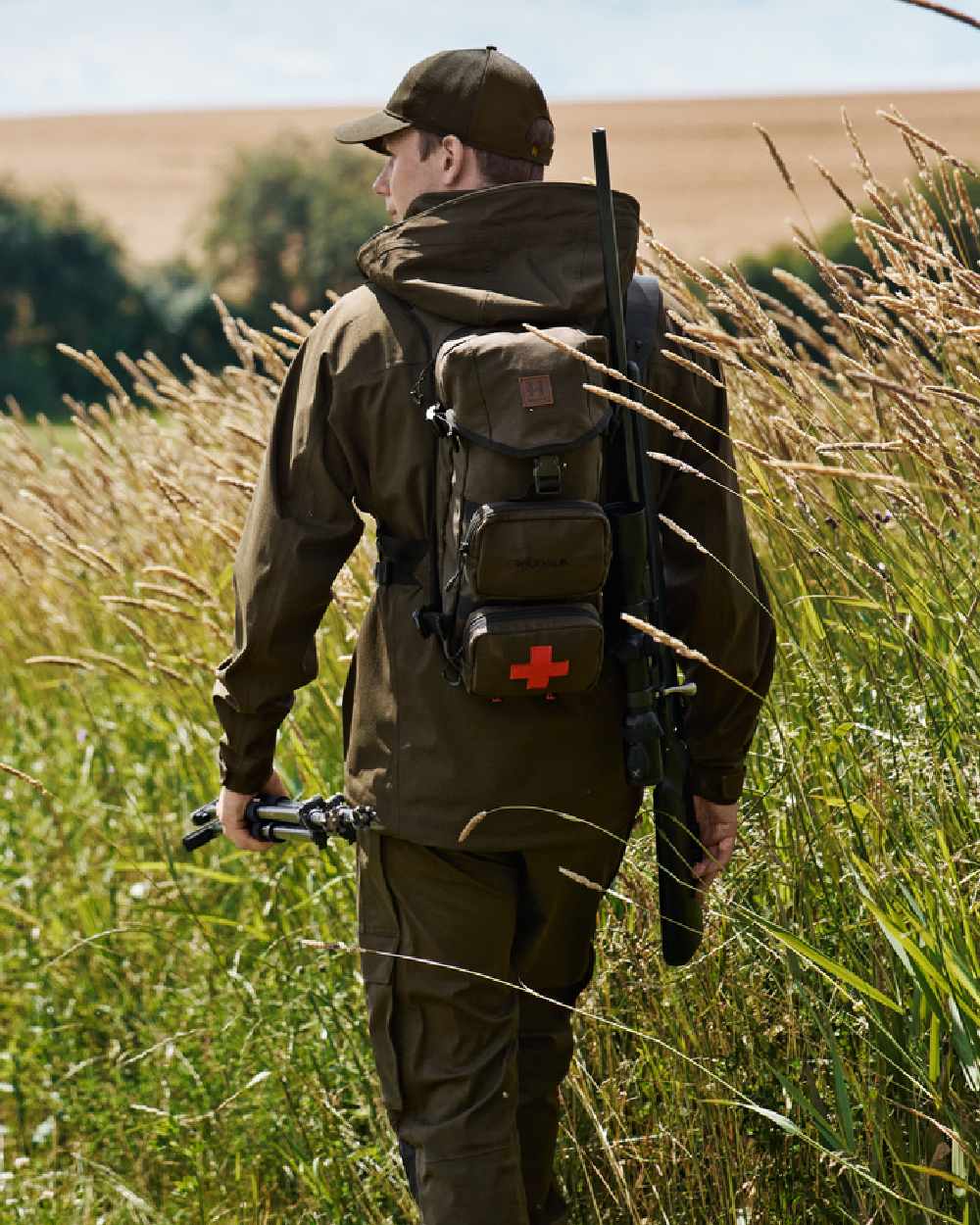 Willow Green Coloured Harkila Ragnar First Aid Backpack on forest background 
