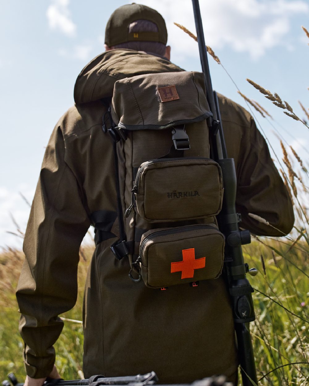 Willow Green Coloured Harkila Ragnar First Aid Backpack on forest background 