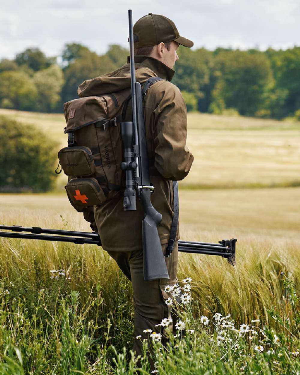 Willow Green Coloured Harkila Ragnar First Aid Backpack on forest background 
