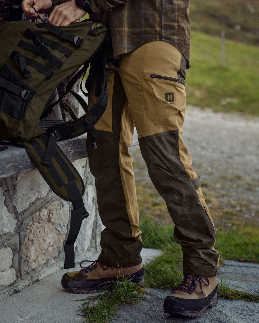 Shadow Brown Golden Brown Coloured Harkila Ragnar Trousers on outdoor background 