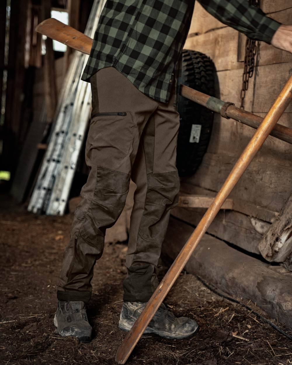 Slate Brown Willow Green Coloured Harkila Ragnar Trousers on outdoor background 