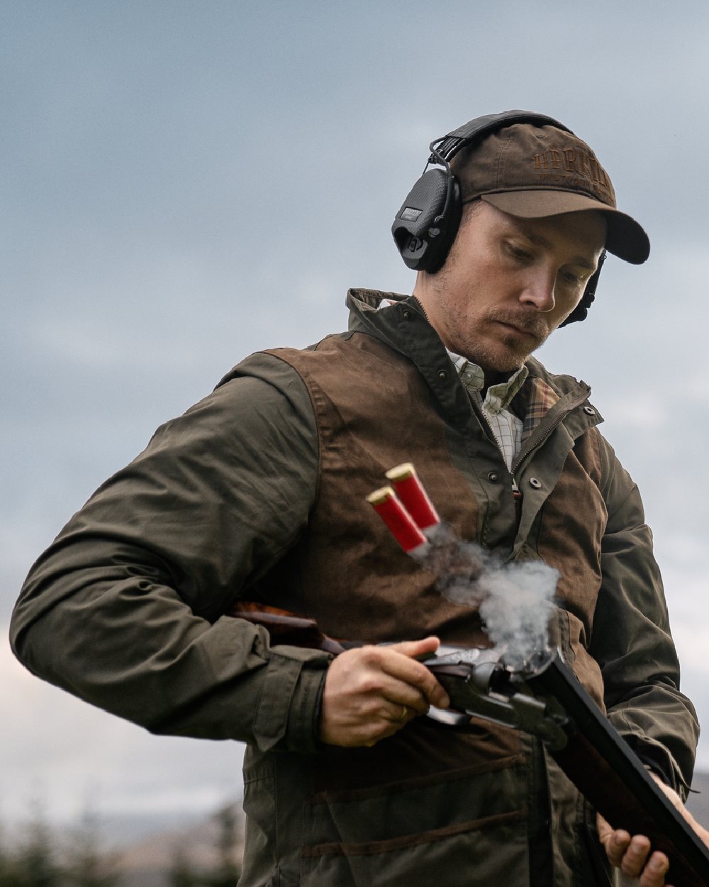 Willow Green Coloured Harkila Rannoch HWS Shooting Jacket on forest background 
