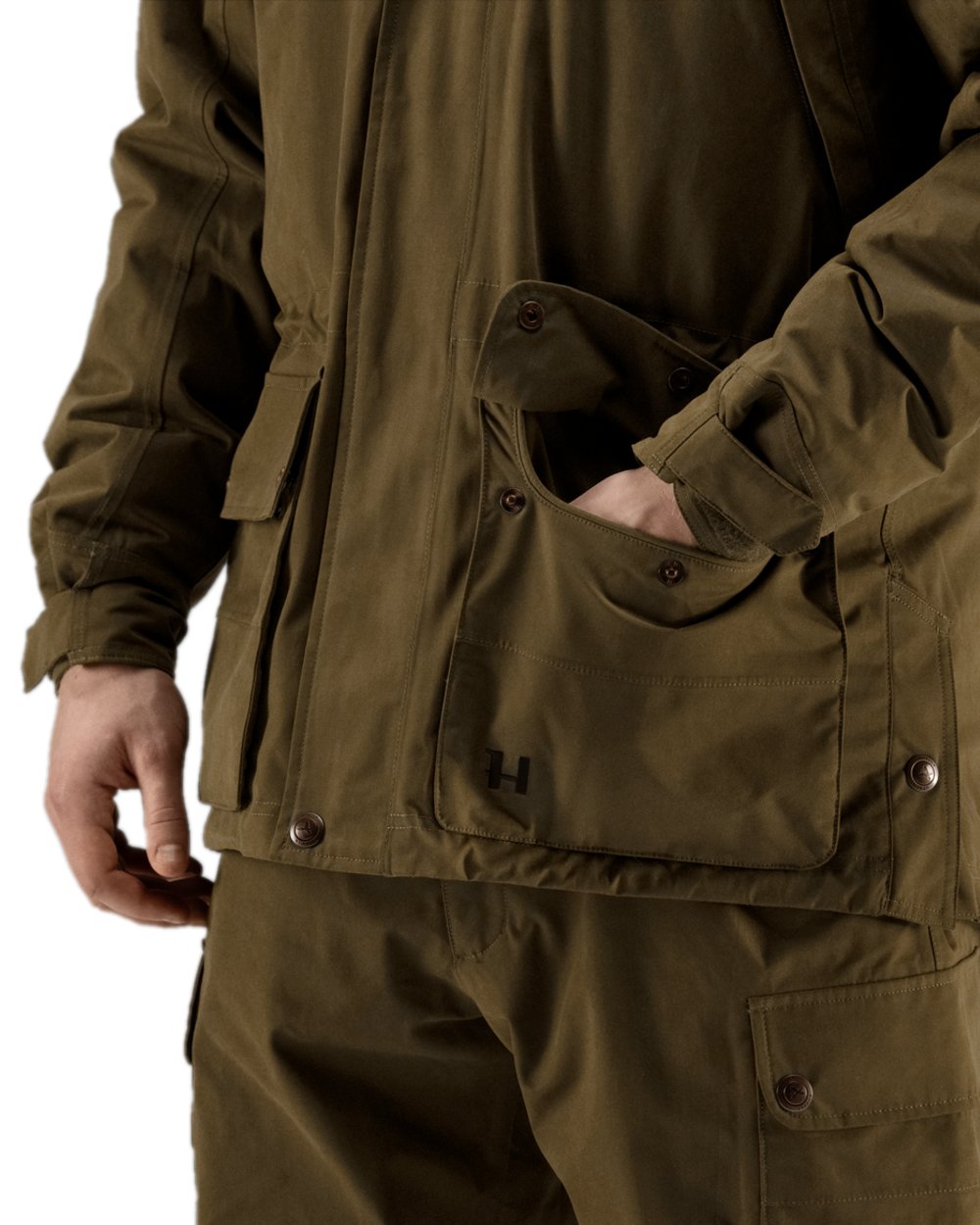 Warm Olive Coloured Harkila Retrieve Jacket on white background 