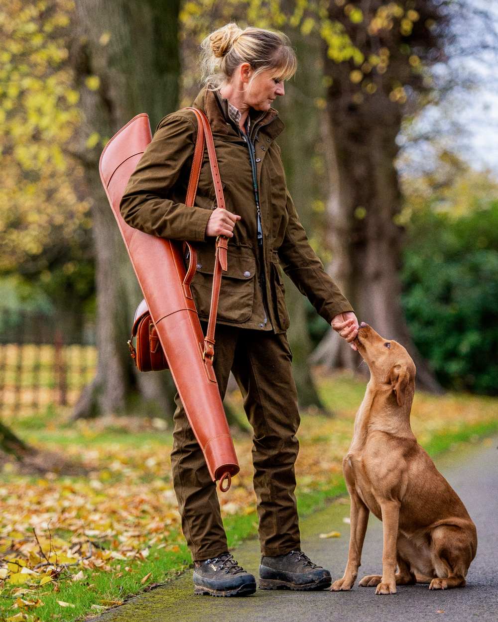 Warm Olive Coloured Harkila Retrieve Lady Jacket on outdoor background 