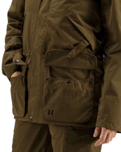 Warm Olive Coloured Harkila Retrieve Lady Jacket on white background 